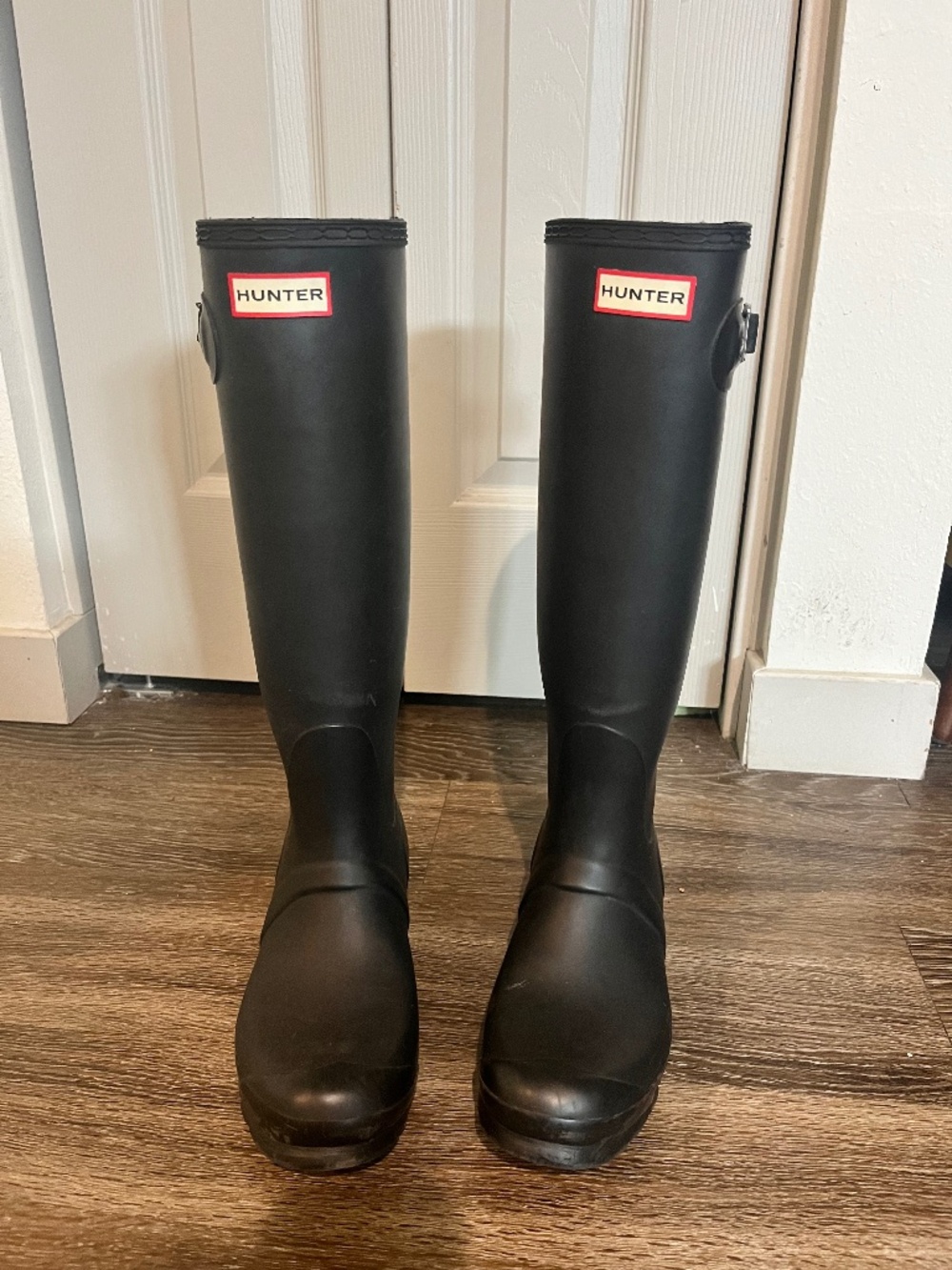 Women’s tall black hunter boots with socks